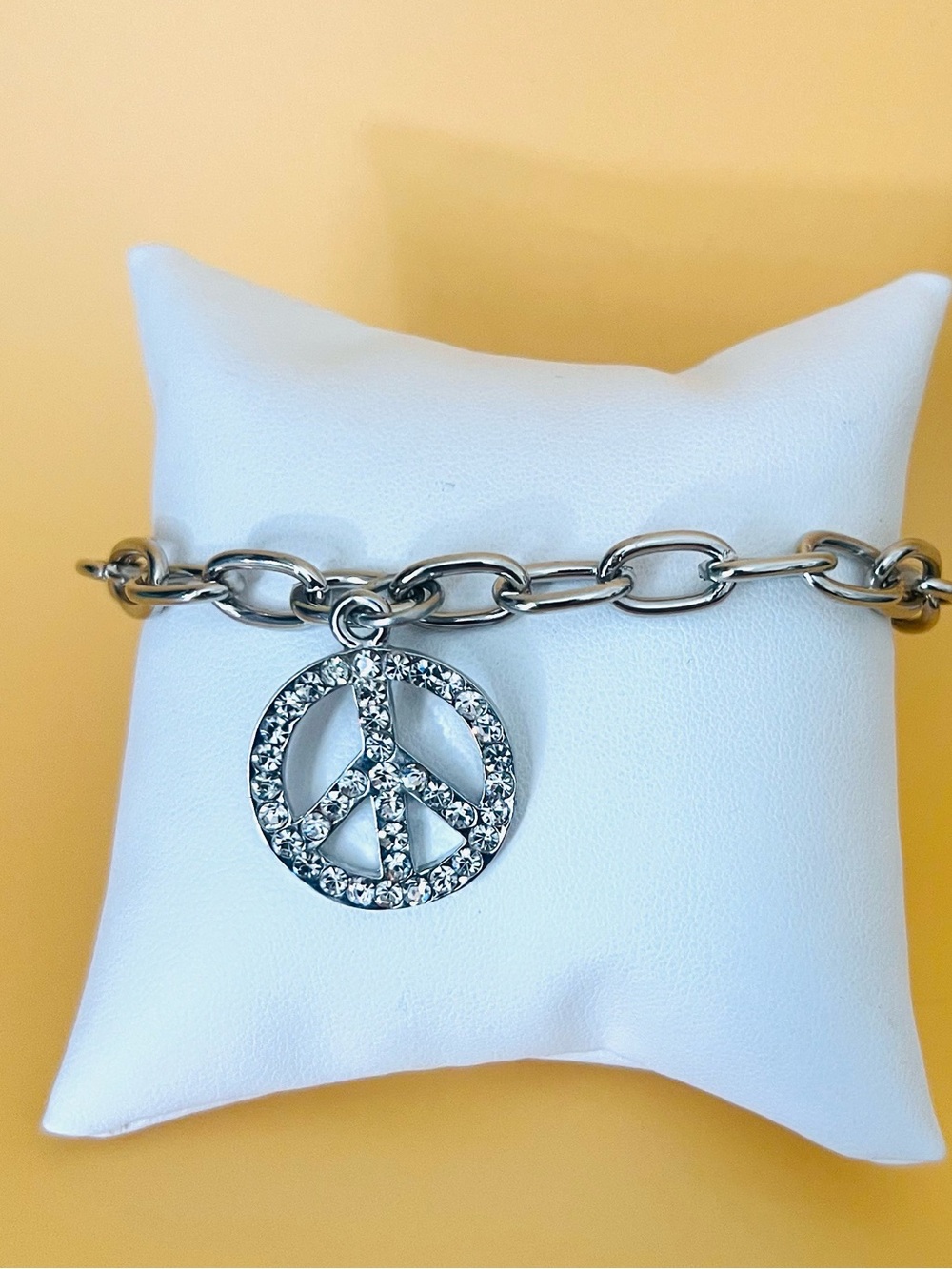 Stainless steel bracelet with paved peace sign  charm & a round toggle